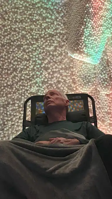 Happy Guest Relaxing in the Salt Cave